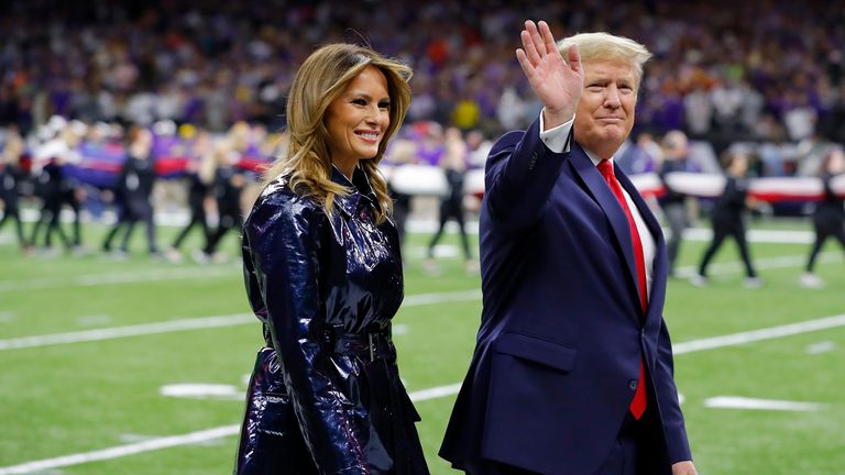 First Lady Melania Trump and U.S. President Donald Trump wave prior to the College Football Playoff National Championship game between the Clemson Tigers and the LSU Tigers at Mercedes Benz Superdome on January 13, 2020 in New Orleans, Louisiana