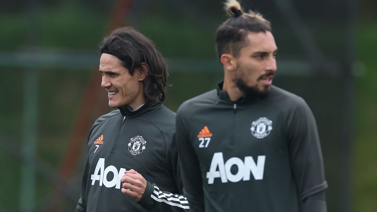 Edinson Cavani pictured alongside fellow new signing Alex Telles