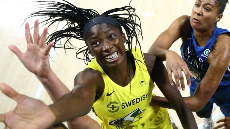 Ezi Magbegor leaps for a rebound against the Minnesota Lynx