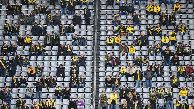 Spectators keep distance in the stands during the Bundesliga match between Borussia Dortmund and SC Freiburg in October