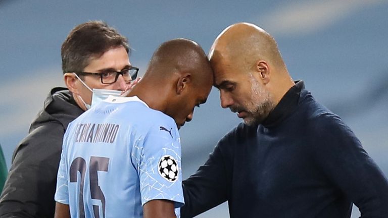 Pep Guardiola consoles Fernandinho after the midfielder suffered a recurrence of a muscle injury 