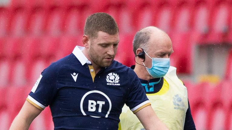 Scotland's Finn Russell leaves the field with an injury during the Six Nations win over Wales in Llanelli.