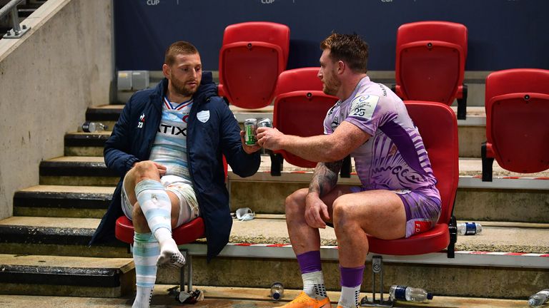 Finn Russell (L) and Stuart Hogg share a beer after the final