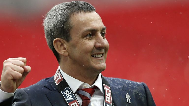 Fleetwood Town chairman Andy Pilley celebrates after the team won the English League 2 Play-Off final football match against Burton Albion at Wembley Stadium in London on May 26, 2014. AFP PHOTO/ADRIAN DENNIS == NOT FOR MARKETING OR ADVERTISING USE / RESTRICTED TO EDITORIAL USE == (Photo credit should read ADRIAN DENNIS/AFP via Getty Images)