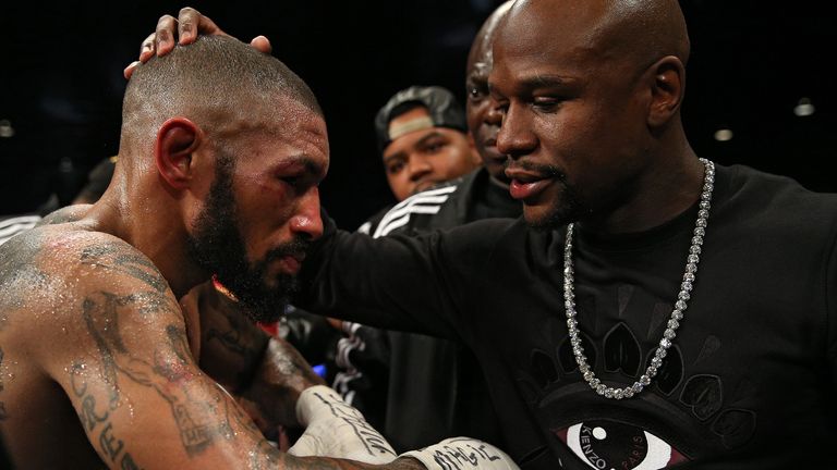 A defeated Theophane consoled by Mayweather