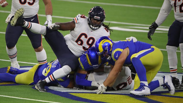 Nick Foles of the Chicago Bears is tackled by Aaron Donald and Greg Gaines of the Los Angeles Rams