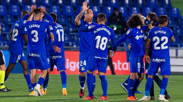 The Getafe players celebrate after their victory over Barcelona