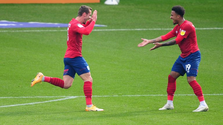 SWANSEA, WALES - OCTOBER 17: Harry Toffolo of Huddersfield Town celebrates scoring the opening goal during the Sky Bet Championship match between Swansea City and Huddersfield Town at the Liberty Stadium on October 17, 2020 in Swansea, Wales. (Photo by Athena Pictures/Getty Images)