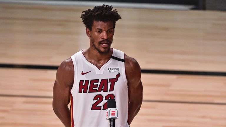 Jimmy Butler of the Miami Heat talks to the media on the court against the Los Angeles Lakers during Game Five of the NBA Finals