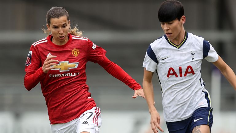 Tobin Heath of Manchester United Women and Ashleigh Neville of Tottenham Hotspur Women