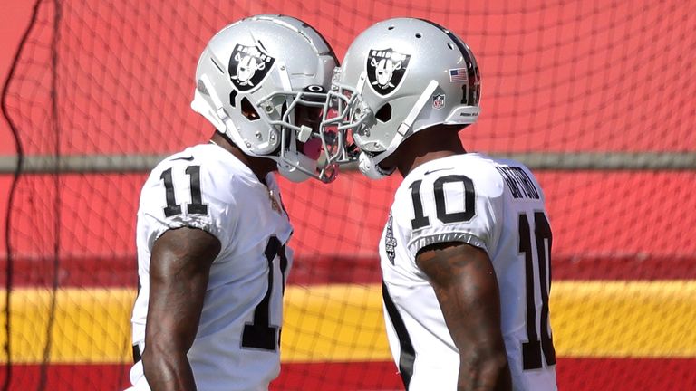 Henry Ruggs (L) celebrates his 72-yard touchdown for the Las Vegas Raiders with teammate Rico Gafford