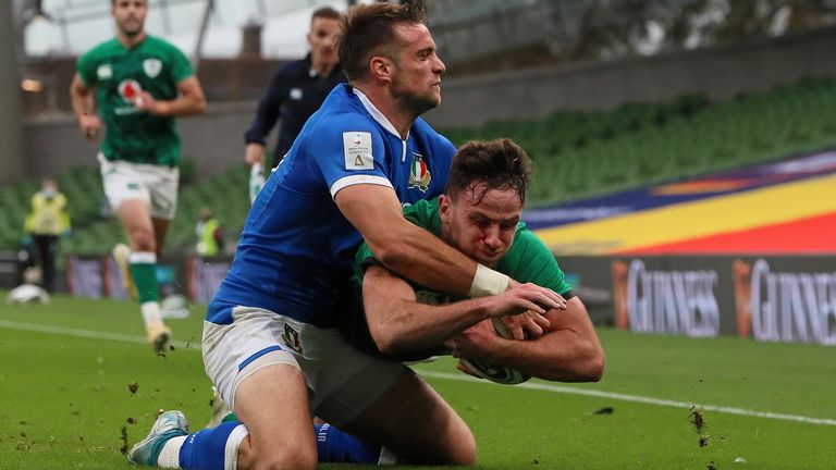 Hugo Keenan dives to scores his second try against Italy