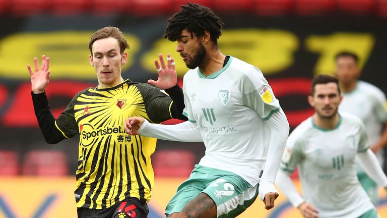 James Garner of Watford battles for possession with Philip Billing of Bournemouth