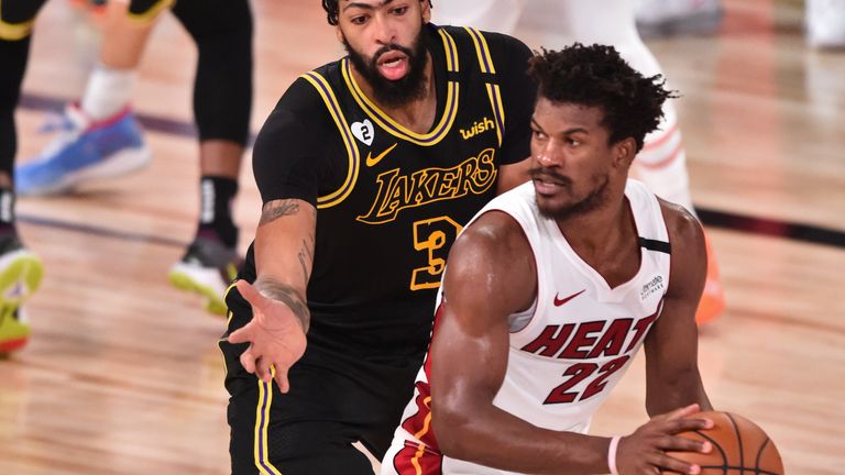 Anthony Davis of the Los Angeles Lakers plays defense on Jimmy Butler of the Miami Heat during Game Five