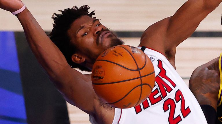 Jimmy Butler appeals for a foul following pressure from LeBron James and Dwight Howard