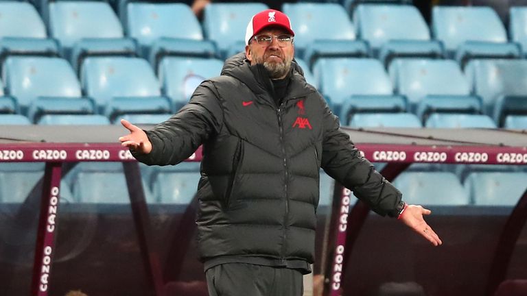 Jurgen Klopp gestures on from his technical area at Villa Park