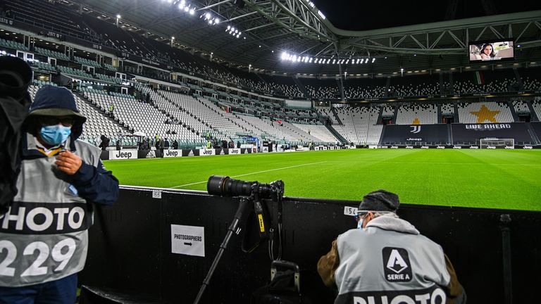 Sports photographers wait on October 4, 2020 at the Juventus stadium in Turin, prior to the Italian Serie A football match Juventus vs Napoli,