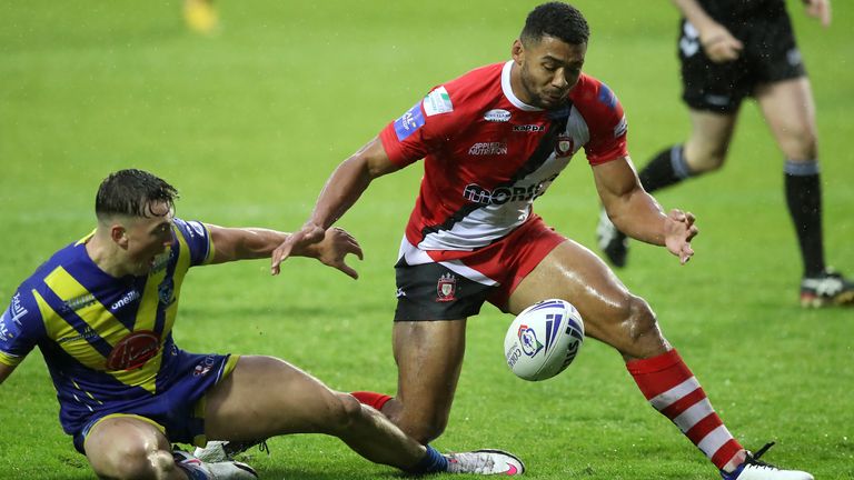 Salford Red Devils v Warrington Wolves - Coral Challenge Cup - Semi Final - Totally Wicked Stadium
Salford Red Devils' Kallum Watkins (right) scores his side's first try of the game during the Coral Challenge Cup, Semi Final at The Totally Wicked Stadium, St Helens.