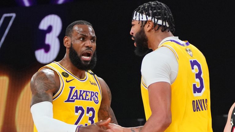 LeBron James and Anthony Davis encourage each other during the Lakers&#39; Game 1 win over the Miami Heat