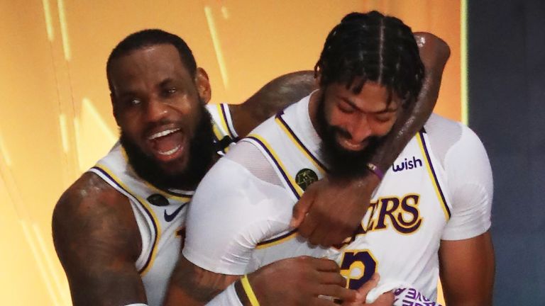 LeBron James hugs team-mate Anthony Davis after leading the Lakers to a series-clinching Game 6 win over the Heat