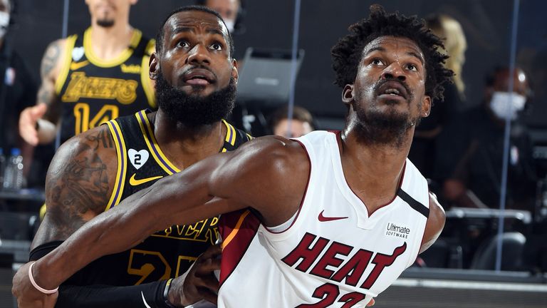 LeBron James and Jimmy Butler compete for a rebound during Game 5 of the NBA Finals