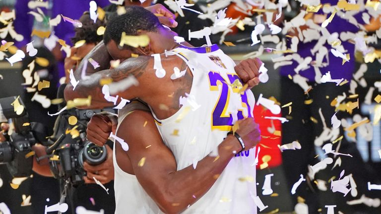 LeBron James hugs Rajon Rondo after the Los Angeles Lakers sealed the NBA championship with a 4-2 series win over the Miami Heat