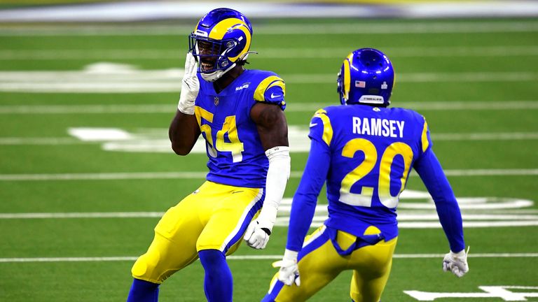 Outside linebacker Leonard Floyd of the Los Angeles Rams looks at the Chicago Bears bench as he celebrates with cornerback Jalen Ramsey after stopping the Chicago Bears