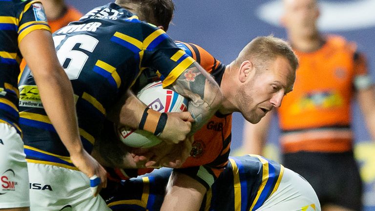 Castleford try-scorer Liam Watts takes on the Leeds defence