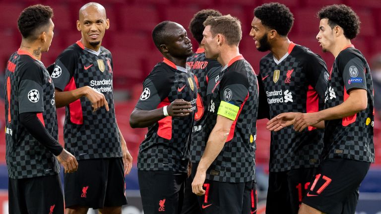 Liverpool players celebrate taking the lead at Ajax in their Champions League opener