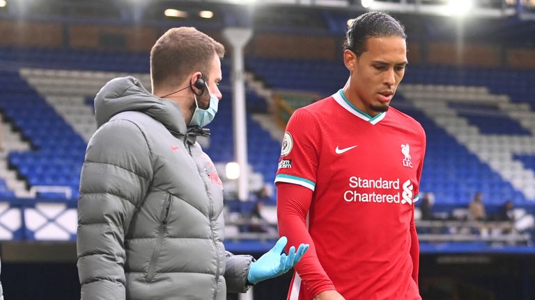 Virgil van Dijk of Liverpool comes off due to an injury during the Premier League match between Everton and Liverpool at Goodison Park on October 17, 2020 in Liverpool, England. Sporting stadiums around the UK remain under strict restrictions due to the Coronavirus Pandemic as Government social distancing laws prohibit fans inside venues resulting in games being played behind closed doors.