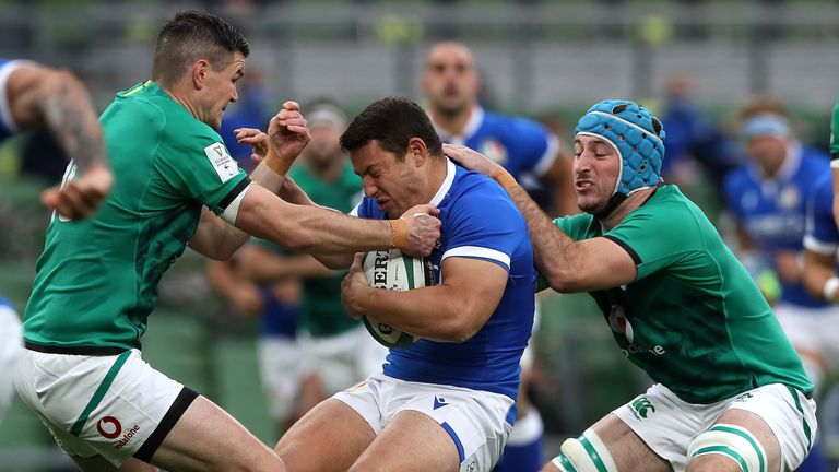 Luca Morisi of Italy is tackled by Johnny Sexton and Will Connors