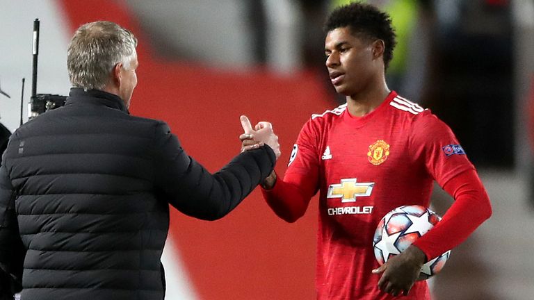 Manchester United's Marcus Rashford (right) and manager Ole Gunnar Solskjaer after the striker scored a hat-trick against RB Leipzig