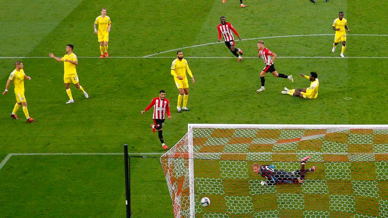 Marcus Forss tucks away the opener for Brentford against Fulham