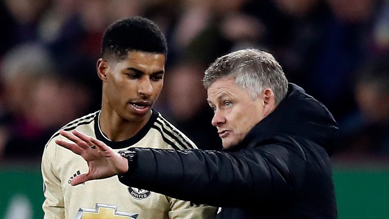 Manchester United manager Ole Gunnar Solskjaer (right) and Marcus Rashford talk on the touchline