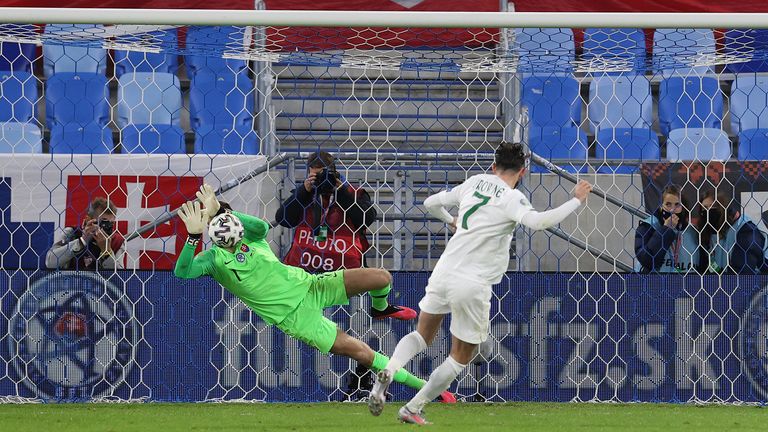 Marek Rodak dives to save Alan Browne's effort to give Slovakia the edge