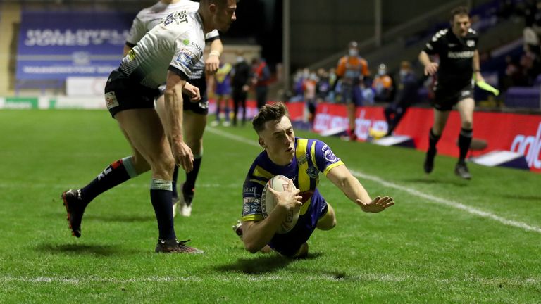 Warrington Wolves' Matty Ashton dives in to score his side's second try