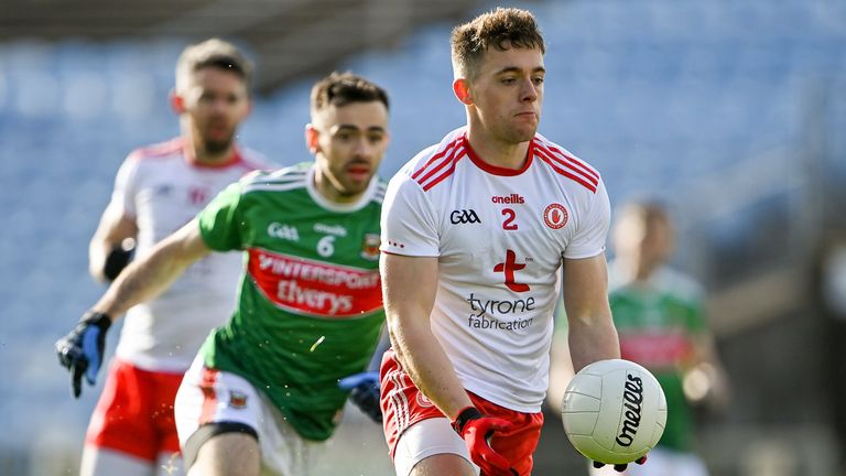 Liam Rafferty of Tyrone in action against Kevin McLoughlin of Mayo