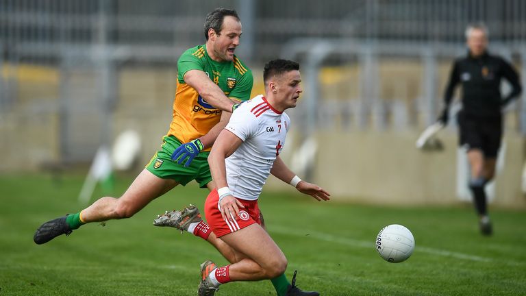 Michael McKernan of Tyrone in action against Michael Murphy of Donegal