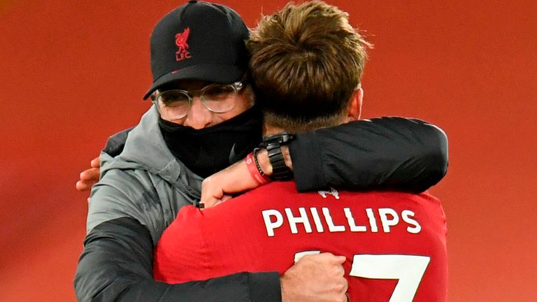 Nat Phillips and Jurgen Klopp embrace at full time