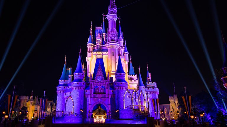 Cinderella Castle is lit up on purple and gold in honour of the Los Angeles Lakers winning the 2020 NBA Finals