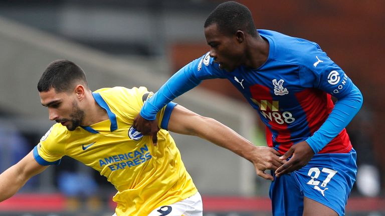 Brighton striker Neal Maupay is challenged by Tyrick Mitchell of Crystal Palace