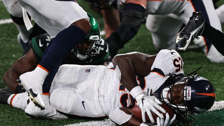 Melvin Gordon #25 of the Denver Broncos dives over the goal line for a touchdown against the New York Jets during the second quarter at MetLife Stadium on October 01, 2020 in East Rutherford, New Jersey. 