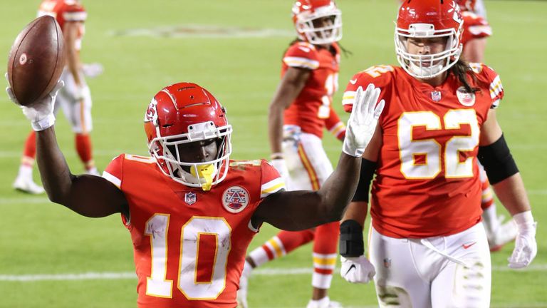 Tyreek Hill #10 of the Kansas City Chiefs celebrates after scoring a touchdown against the New England Patriots during the second half at Arrowhead Stadium on October 05, 2020 in Kansas City, Missouri. 
