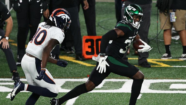 Pierre Desir #35 of the New York Jets runs back an interception for a touchdown against Jerry Jeudy #10 of the Denver Broncos during the fourth quarter at MetLife Stadium on October 01, 2020 in East Rutherford, New Jersey. 