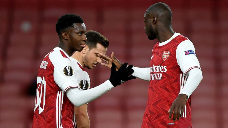 LONDON, ENGLAND - OCTOBER 29: Eddie Nketiah of Arsenal celebrates with teammate Cedric Soares and Nicolas Pepe of Arsenal after scoring his team's first goal during the UEFA Europa League Group B stage match between Arsenal FC and Dundalk FC at Emirates Stadium on October 29, 2020 in London, England. 