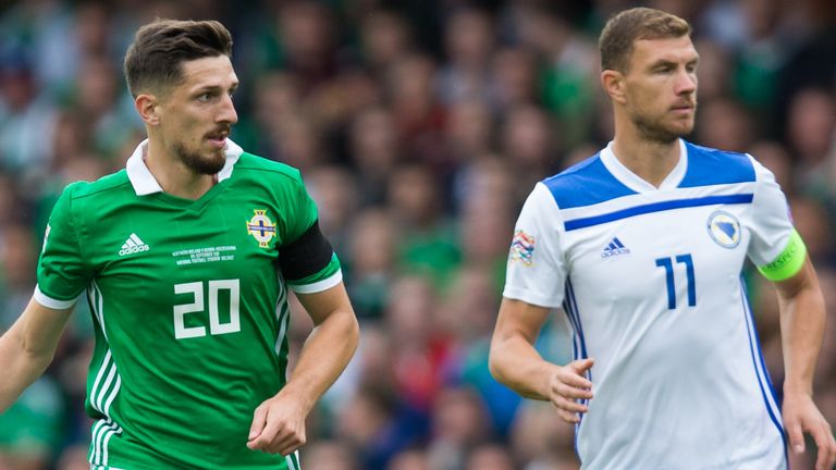 Craig Cathcart of Northern Ireland and Edin Dzeko 