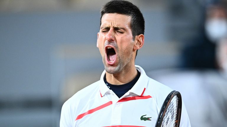Serbia's Novak Djokovic celebrates after winning against Spain's Pablo Carreno Busta during their men's singles quarter-final tennis match on Day 11 of The Roland Garros 2020 French Open tennis tournament in Paris on October 7, 2020.