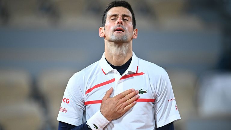 Serbia's Novak Djokovic celebrates after winning against Spain's Pablo Carreno Busta during their men's singles quarter-final tennis match on Day 11 of The Roland Garros 2020 French Open tennis tournament in Paris on October 7, 2020. (Photo by Anne-Christine POUJOULAT / AFP) (Photo by ANNE-CHRISTINE POUJOULAT/AFP via Getty Images)