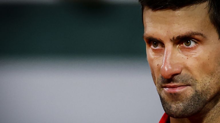 Serbia's Novak Djokovic reacts as he plays against Greece's Stefanos Tsitsipas during their men's singles semi-final tennis match on Day 13 of The Roland Garros 2020 French Open tennis tournament in Paris on October 9, 2020