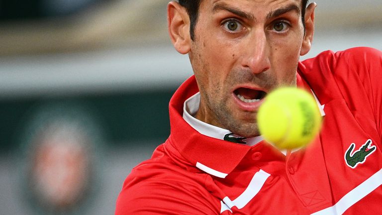 Serbia's Novak Djokovic eyes the ball as he plays against Spain's Rafael Nadal during their men's final tennis match at the Philippe Chatrier court on Day 15 of The Roland Garros 2020 French Open tennis tournament in Paris on October 11, 2020
